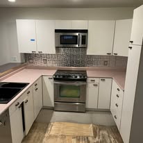 White kitchen remodel with gas range