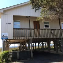 Coastal beach house exterior after renovation